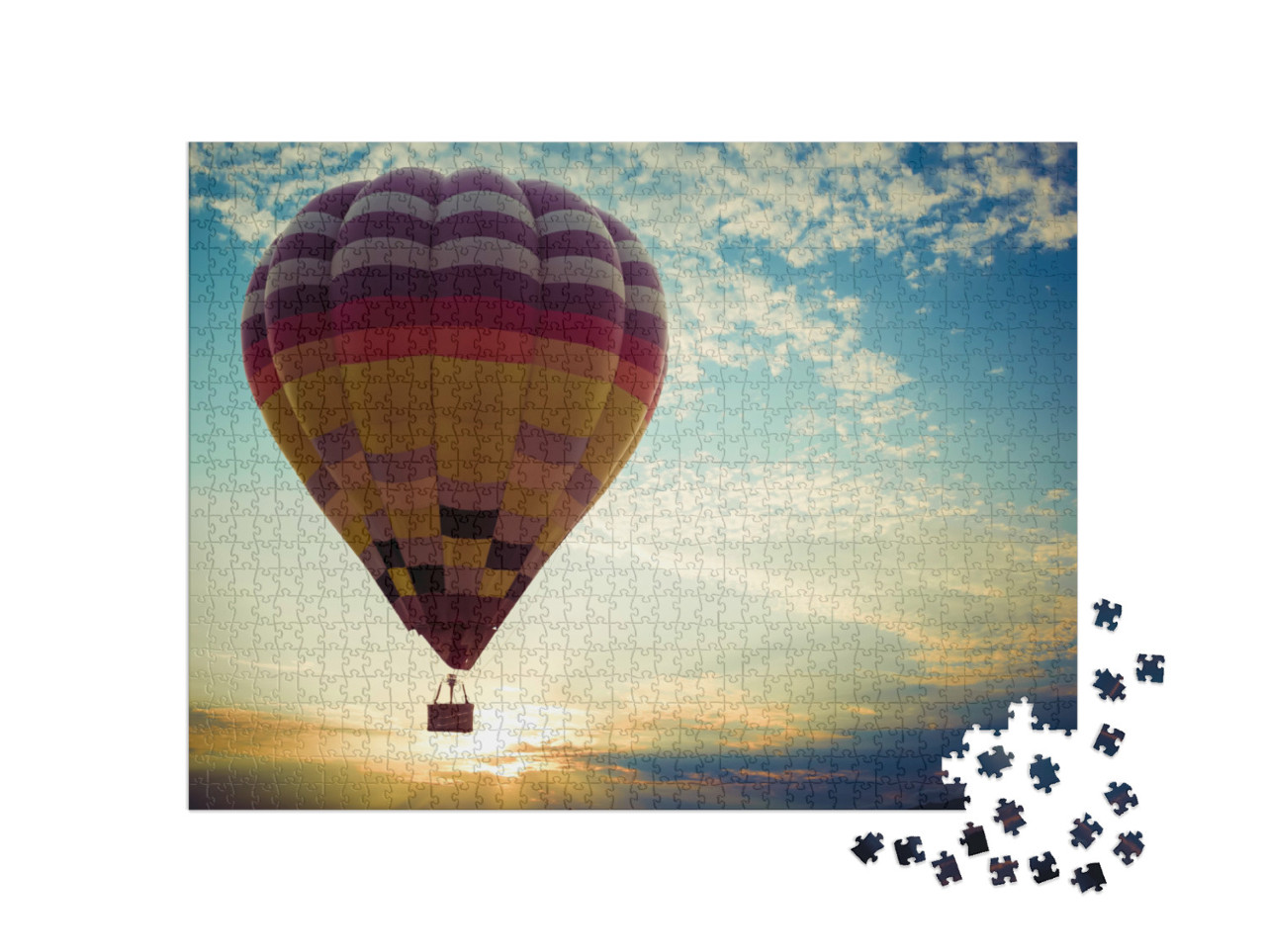 Puzzel 1000 stukjes „Kleurrijke heteluchtballon op reis naar de zonsondergang“