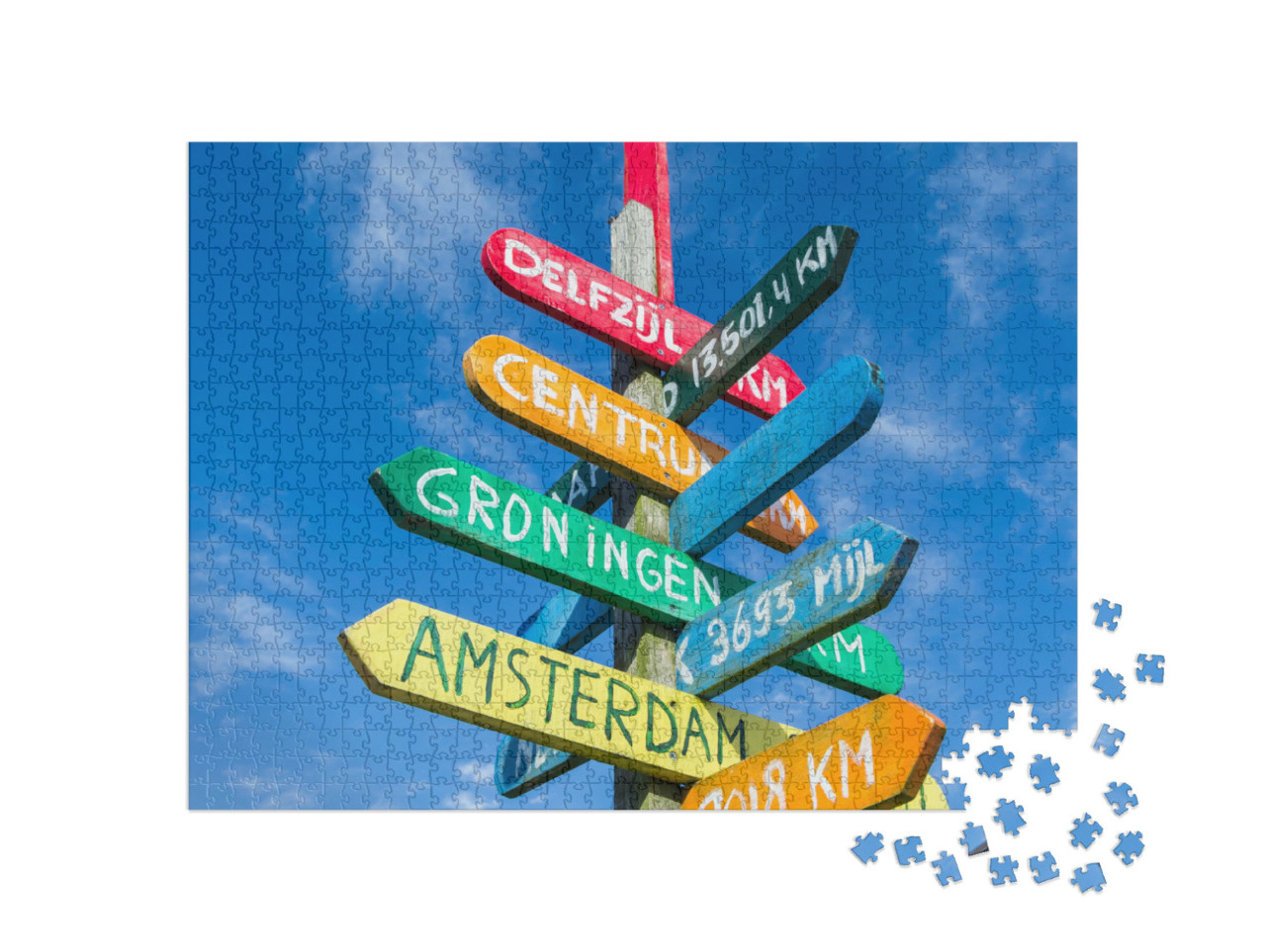 Puzzel 1000 stukjes „Kleurrijke wegwijzer naar verschillende steden in Appingedam, Nederland“