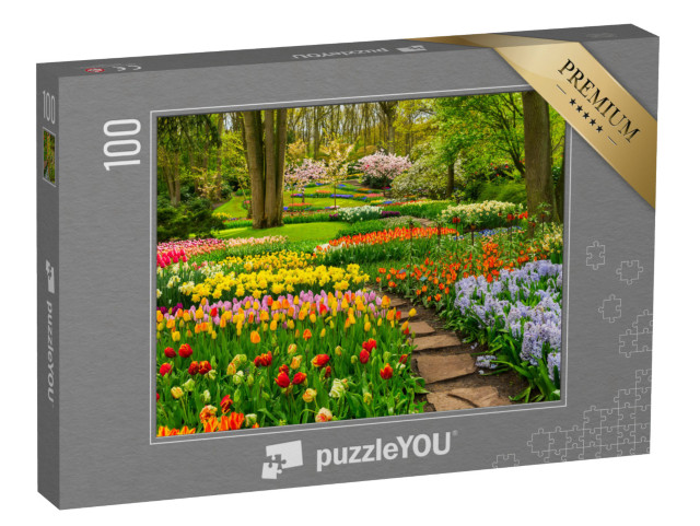 Puzzel 100 stukjes „Kleurrijke tulpentuin onder bomen“