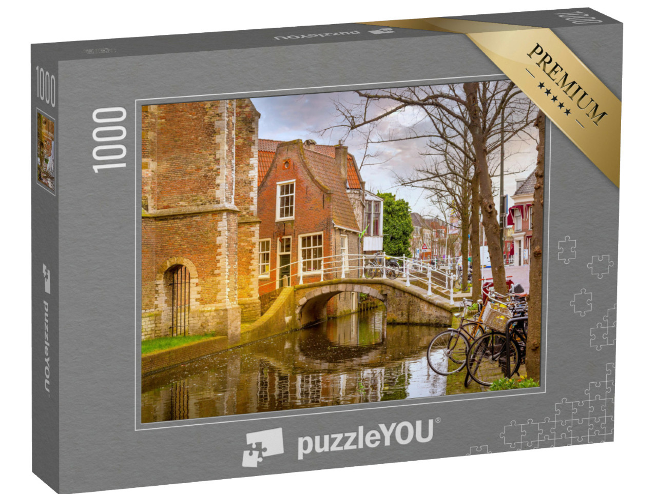 Puzzel 1000 stukjes „Delft met traditionele Nederlandse huizen, brug en gracht in het stadscentrum“