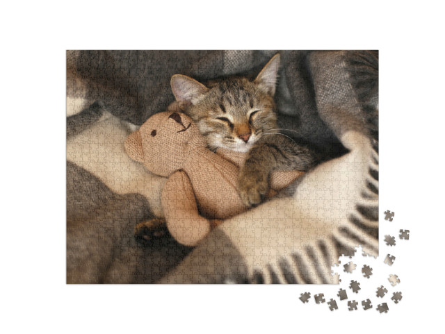 Puzzel 1000 stukjes „Kleine kitten doet een dutje met zijn favoriete knuffeldier“