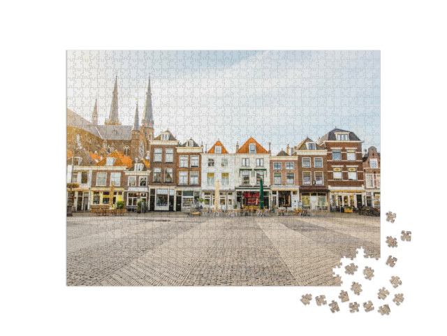 Puzzel 1000 stukjes „Zicht op de prachtige gevels en de kerk op het centrale plein in Delft“