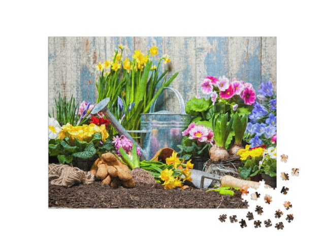 Puzzel 1000 stukjes „Tuingereedschap en bloemen in de tuin“