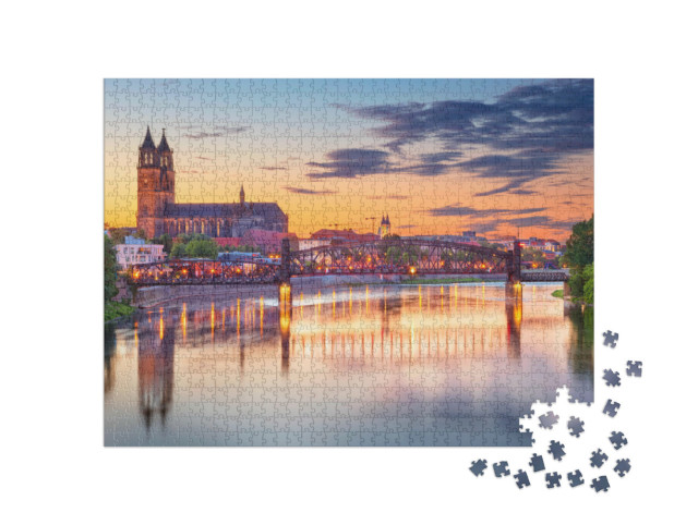 Puzzel 1000 stukjes „Stadsgezicht van Magdeburg met de Elbe bij zonsondergang, Duitsland“