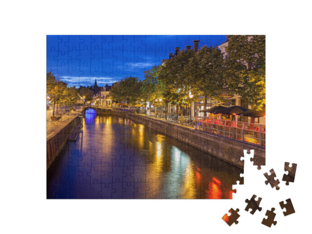 Puzzel 200 stukjes „Grachten door de prachtige stad Leeuwarden, hoofdstad van Friesland“