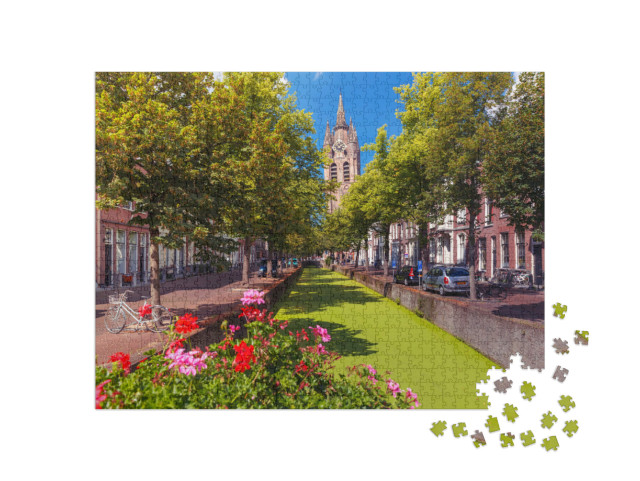 Puzzel 1000 stukjes „De Oude Delftse gracht en de scheve toren van de Oude Kerk in Delft, Zuid-Holland“