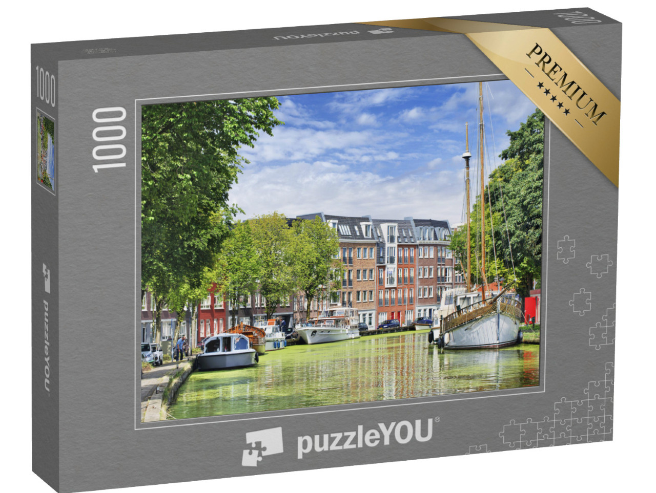 Puzzel 1000 stukjes „Groene gracht met jachten en woongebouwen in Gouda, Nederland“