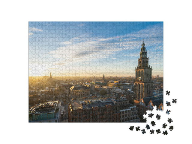 Puzzel 1000 stukjes „De zonsondergang bij de Martinitoren en de historische binnenstad van Groningen“