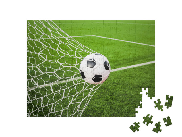 Puzzel 200 stukjes „Voetbal in het doelnet“