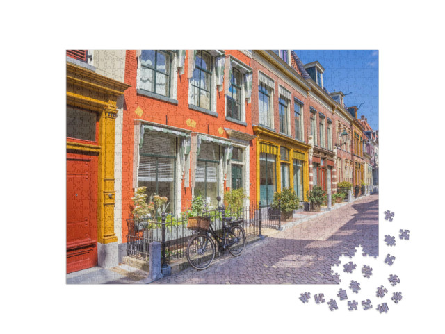 Puzzel 1000 stukjes „Fiets voor de kleurrijke huizen van de historische stad Leeuwarden, Nederland“