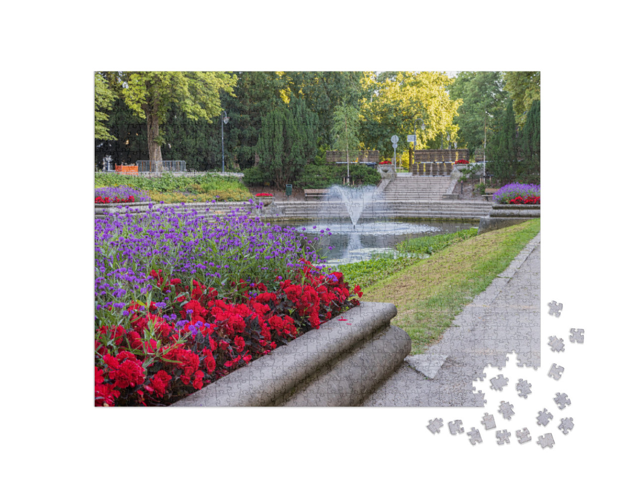Puzzel 1000 stukjes „Fontein en grote vijver omringd door bloemen in het Noorderplantsoen in Groningen“