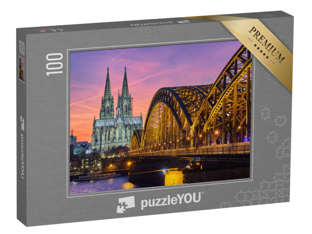 Puzzel 100 stukjes „Dom van Keulen en Hohenzollernbrücke bij zonsondergang“