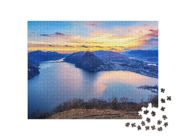 Puzzel 1000 stukjes „Zonsondergang over het Luganomeer in de Zwitserse Alpen“