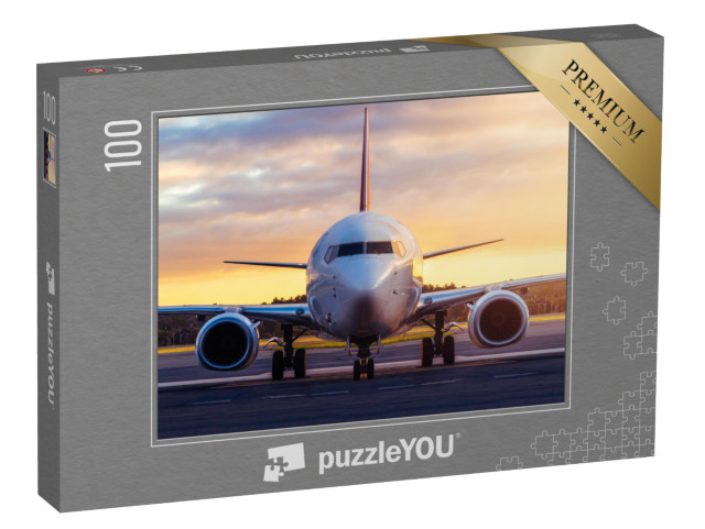 Puzzel 100 stukjes „Vliegtuig klaar om op te stijgen naar de zonsondergang“