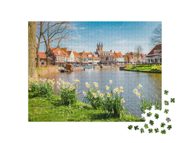 Puzzel 1000 stukjes „Uitzicht op de historische stad Sluis op een zonnige lentedag“