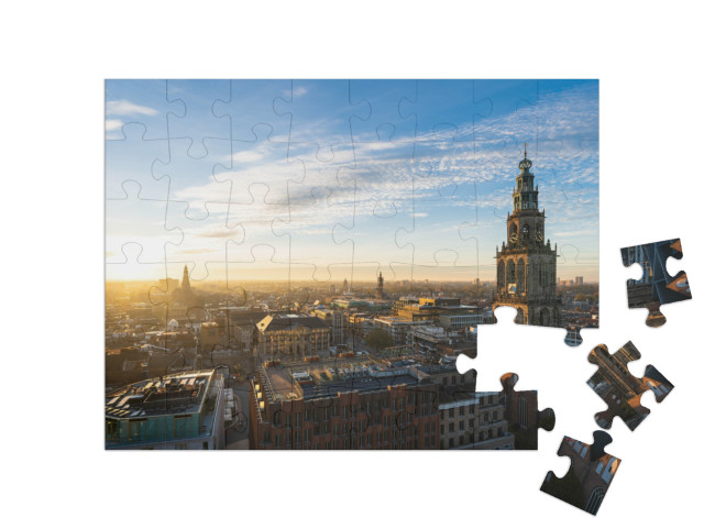 Puzzel 48 stukjes „De zonsondergang bij de Martinitoren en de historische binnenstad van Groningen“