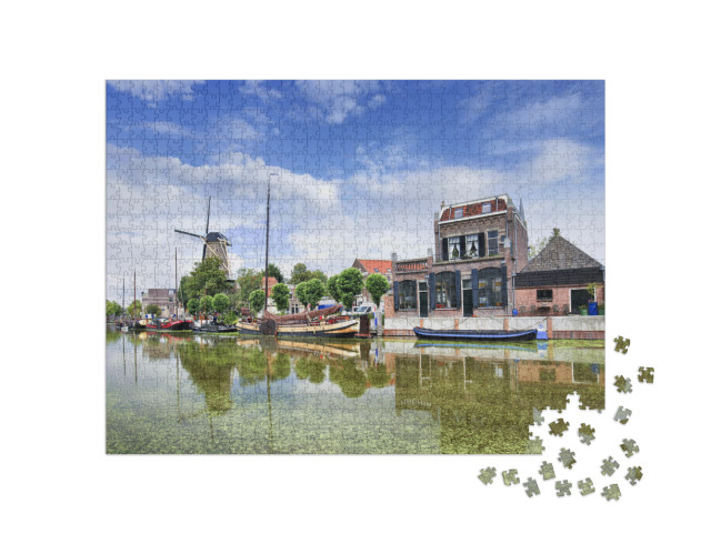 Puzzel 1000 stukjes „Oude binnenstad van Gouda met groene gracht“